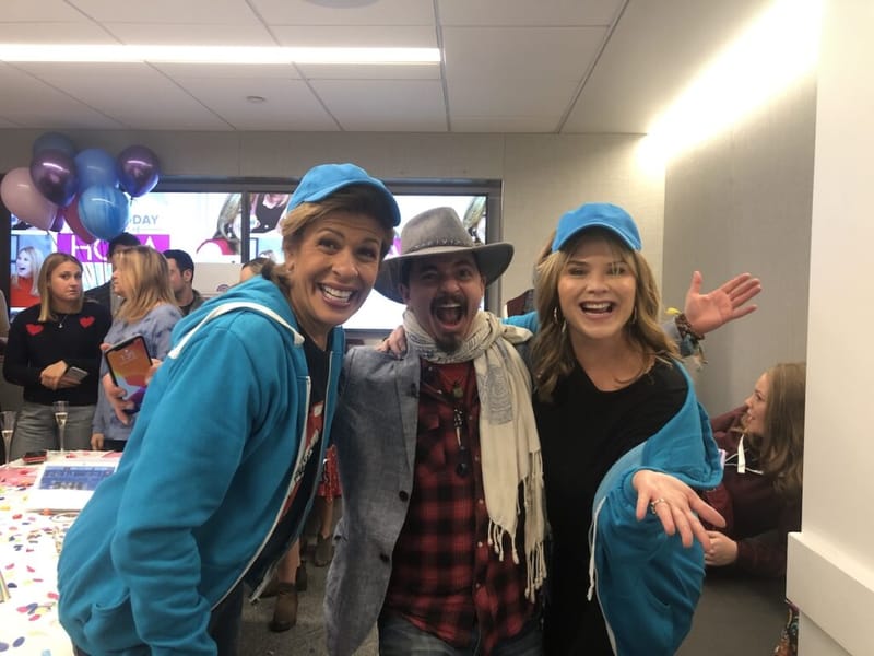Ben Hoffman with Hoda Kotb and Jenna Bush Hager at the Today Show studio, all wearing blue cityHUNT team gear